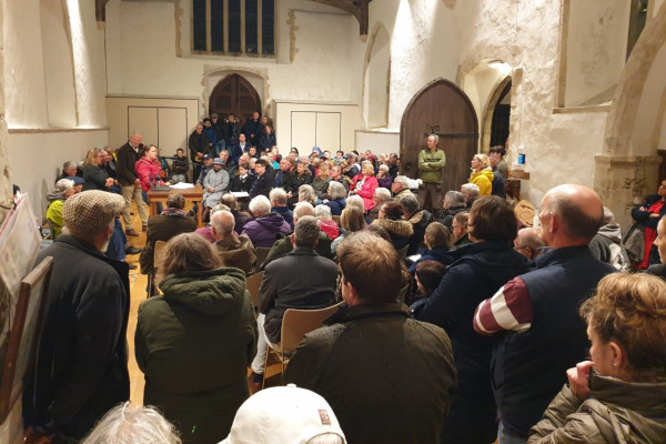Photo of large audience in the church during the meeting